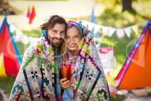 Couple wrap themselves in blanket