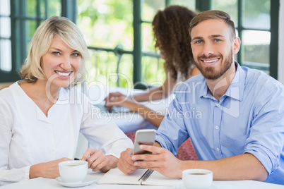 Smiling executives in a restaurant