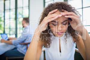 Worried woman sitting in a restaurant