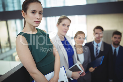 Group of businesspeople standing in the corridor