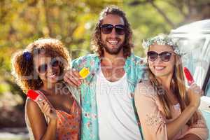 Three friends enjoying and eating ice lolly