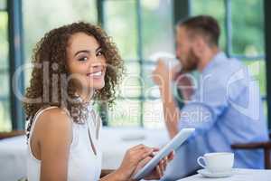 Woman holding digital tablet in a restaurant