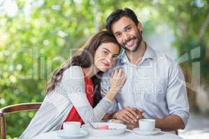 Woman resting her head on mans shoulder