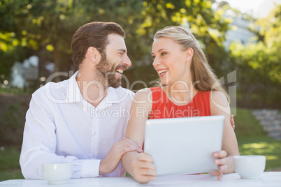 Couple laughing while looking at each other