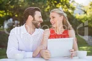 Couple laughing while looking at each other