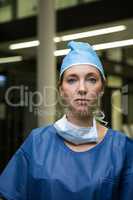 Portrait of female surgeon in protective workwear