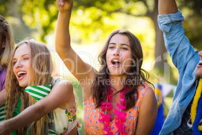 Group of friends dancing at music festival