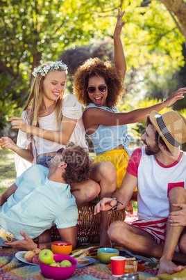 Group of friends having fun together in park