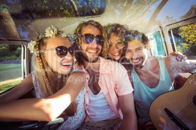 Group of friends travelling in campervan