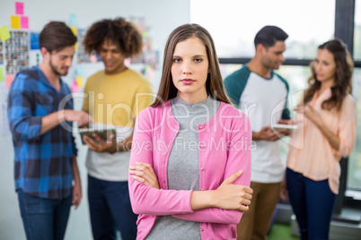 Portrait of female graphic designer standing with arms crossed