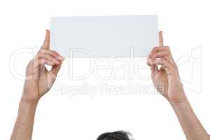 Business executive holding blank placard