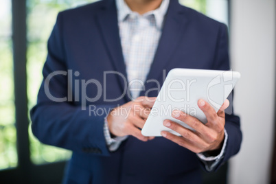 Businessman using digital tablet in a restaurant