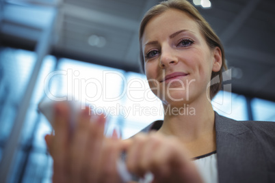 Businesswoman using mobile phone