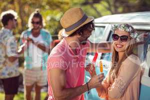 Couple enjoying and eating ice lolly
