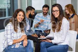 Portrait of female executives sitting in meeting