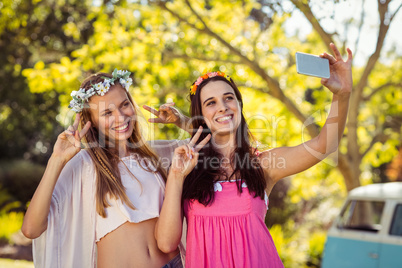 Friends clicking selfie on mobile phones