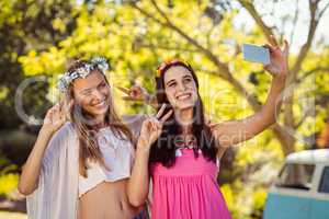Friends clicking selfie on mobile phones