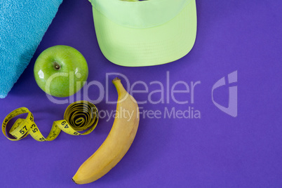 Towel, apple, towel, sun hat and measuring tape