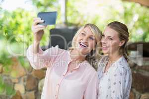 Friends taking a selfie on mobile phone