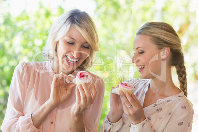 Friends using having sweet food at restaurant