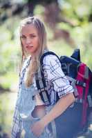 Woman standing with backpack