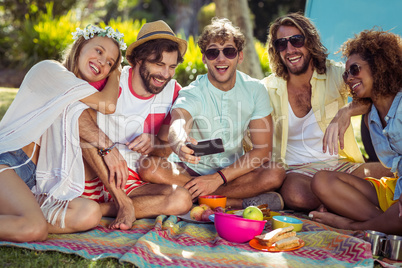 Group of happy friend taking a selfie in park