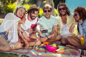 Group of happy friend taking a selfie in park