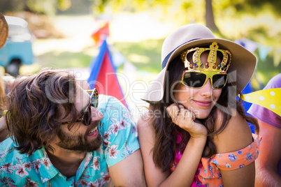 Friends interacting with each other in park