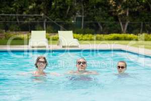 Happy parents and daughter in pool