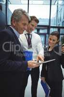 Businesspeople using digital tablet