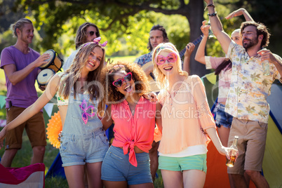 Group of friends having fun together at campsite