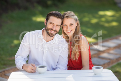 Portrait of happy couple having coffee