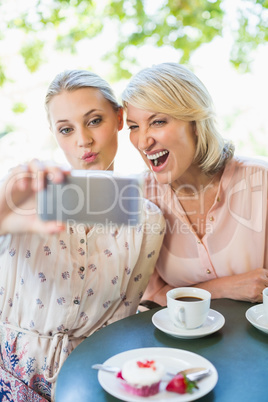 Friends taking a selfie on mobile phone