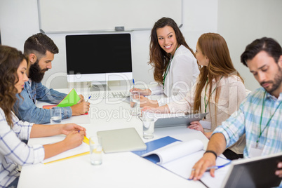 Executives working in conference room