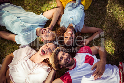 Friends lying on grass