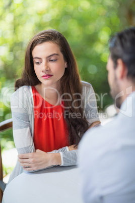 Depressed couple sitting