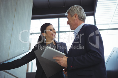 Business executives having a conversation on stairs