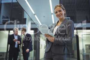 Businesswoman using digital tablet at office