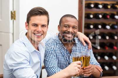 Friends toasting beer glasses