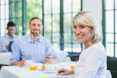 Smiling executives in a restaurant