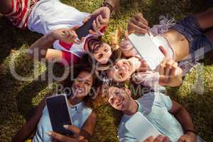 Friends clicking selfie on mobile phones