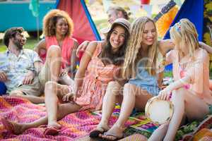 Group of friends having fun together at campsite