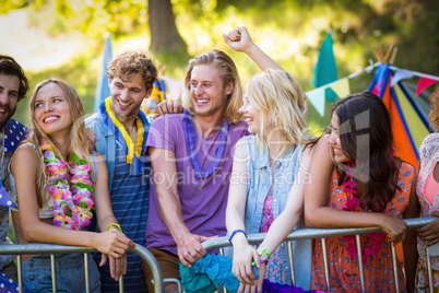 Friends interacting with each other in park