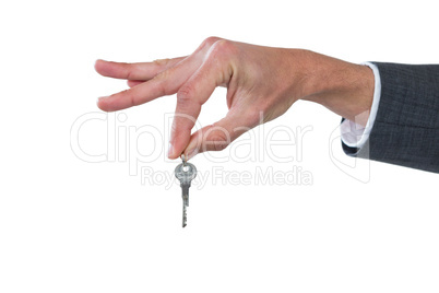 Hand of businessman holding key