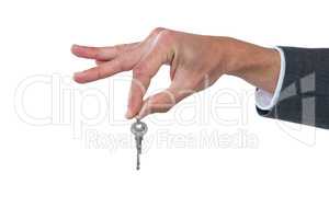 Hand of businessman holding key