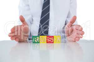 Businessman showing a word RISK