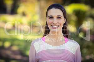 Smiling woman standing in park