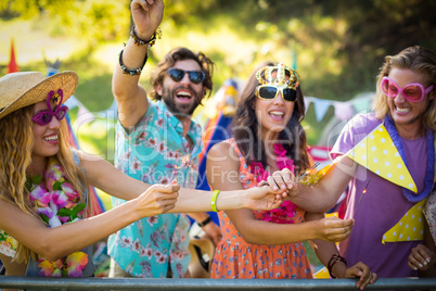 Group of friends dancing at music festival