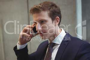 Businessman talking on mobile phone