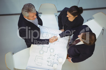 High angle view of businesspeople shaking hands